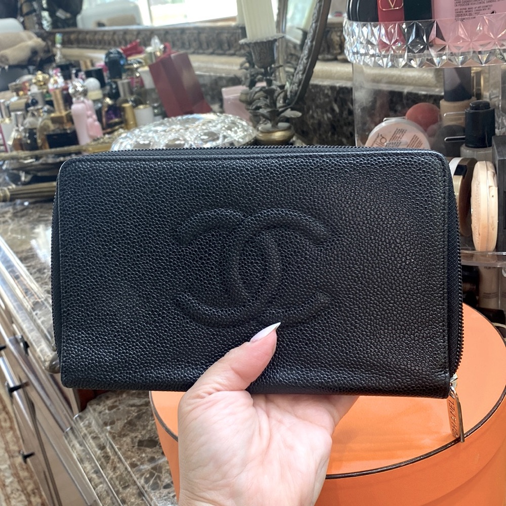 Chanel wallet black zip around large. Used in great condition. Silver hardware.
